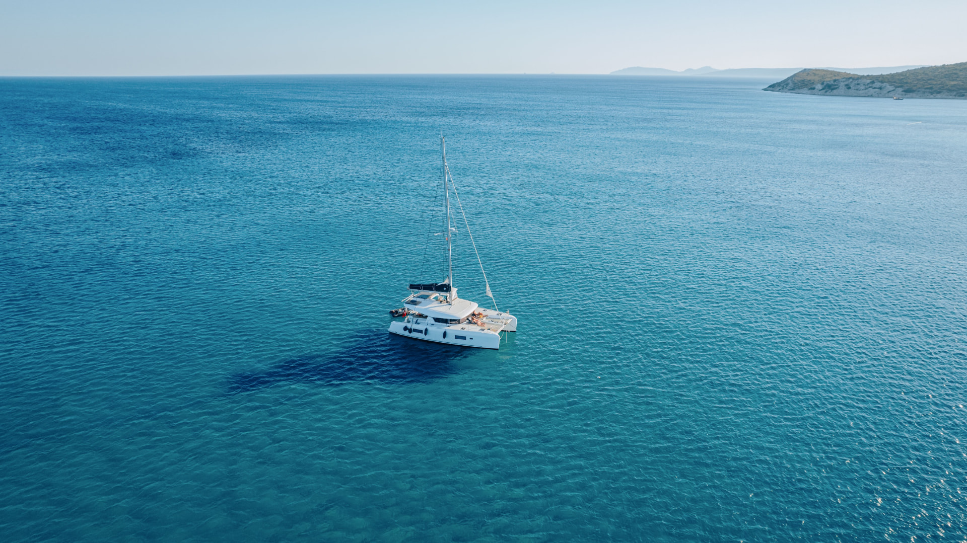 A sailing catamaran in open Mediterranean water